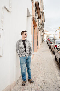 man leaning against wall