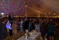 Guests enjoy dancing during tented wedding reception on Nantucket.