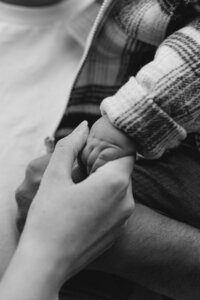 Hands close-up during a family session in Christchurch