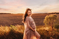 Maternity Photos in Charleston, SC -- Expectant mother poses for Maternity Portraits during Sunset on the Marsh Charleston, SC.
