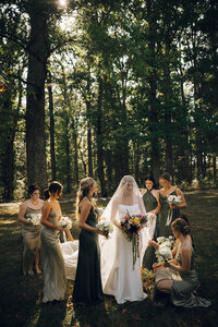 Bridal party portrait in the trees at Keswick Vineyard with floral design by Flowergirl Cville, Charlottesville VA florist | Photo by Abby Hart Photography