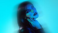 Blue-toned conceptual portrait created for an artistic personal brand photoshoot