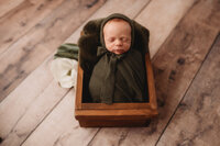 Newborn Photographer in Charleston - Newborn Baby sleeping during Newborn Portrait Session in Charleston, SC.