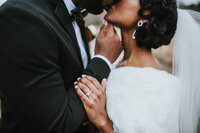 Luxury Portraits by Moving Mountains Photography in NC - photos of a couple kissing on their wedding day with her wedding ring in the photo