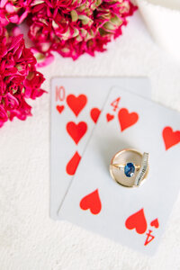 Tennessee wedding photographer photographs bride and grooms rings on deck of cards