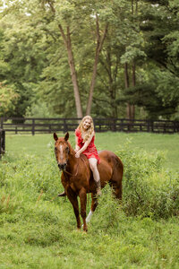 girl riding on horse for Oxford Michigan Senior Photographer Savvy Shoots Photography