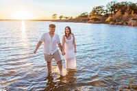 Couple in warm natural light during their engagement session at Murrell Park in Flower Mound with Graceful Ray Photography.