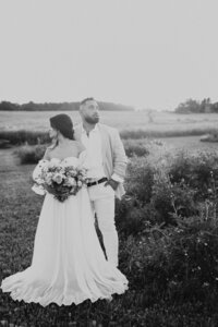 Black and white vintage film inspired wedding portrait session during golden hour