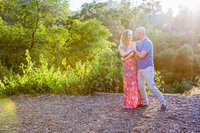 couple holding each other during outdoor maternity portrait session in Los Angeles