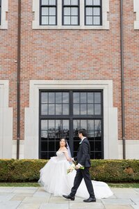 bride walking with groom in rochester hills wedding venue