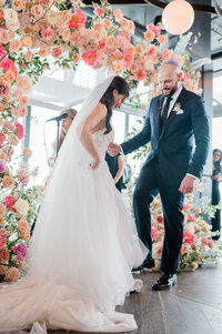 Bride and groom break glass during their Jewish ceremony