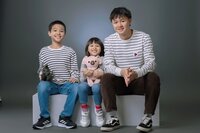 Studio family portrait in Edmonton showing love between siblings