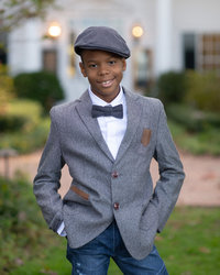 Young boy in bow tie smiles