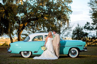 bride and groom with vintage car at sunnyside plantation in murrells inlet, south carolina
