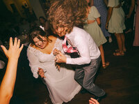 married couple on dance floor at their wedding reception, direct flash reception photos, documentary wedding photographer, nyc wedding photographer