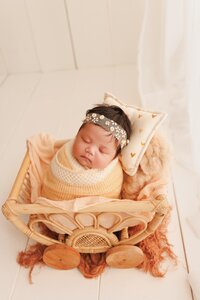 Minimalist newborn photography session in Sacramento featuring neutral tones and soft natural light for a timeless baby portrait