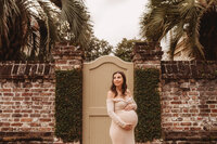 Maternity Photos in Charleston, SC -- Expectant mother poses for Maternity Portraits on Meeting Street in downtown Charleston, SC.