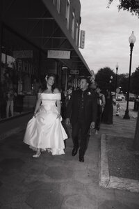 Bride and Groom walking in downtown Covington, Georgia.