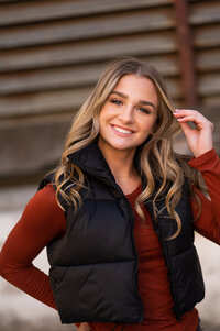 A Germantown High School student stands under a bridge in downtown Waukesha posing for her senior photo.
