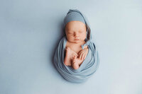 Newborn Pictures in Charleston - Infant posed for Newborn Pictures during Newborn Photoshoot at Holy City Babies Newborn Photography Studio in Charleston, SC.