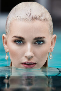 Melissa Goodwin in a crisp, professional portrait, exuding confidence and elegance, captured by Ylva Erevall.