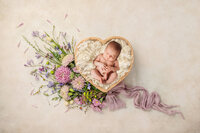 Infant posed for Newborn Photoshoot in Charleston, SC.
