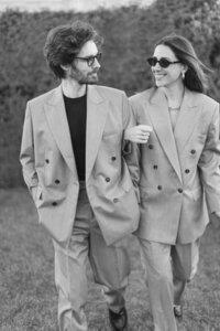 Engagement session at the Tuileries and Louvre in Paris, with a couple walking through the gardens under the morning light.