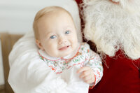 Dondolo christmas branding session. Photo of santa holding a baby.