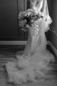 black and white image of brides wedding dress train in detroit wedding
