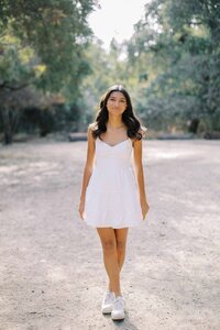 Palo Alto Senior girl posing for her senior portraits at Redwood Grove in Los Altos