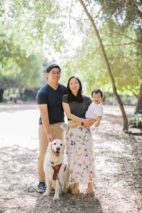 Family of three with their white golden retriever during a Bay Area family session