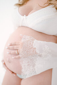 Close up of a pregnant woman holding her belly, Miami Maternity Photographer
