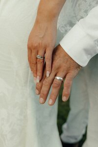 Newlyweds close-up after their ceremony during golden hour in Christchurch