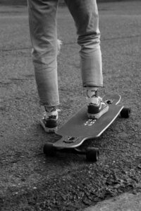 Black-and-white detail of a skateboarder during a creative brand photography session