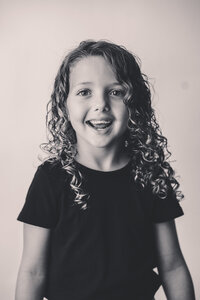 Young girl smiles at the camera during Personality Portrait Photoshoot in Charleston, SC.