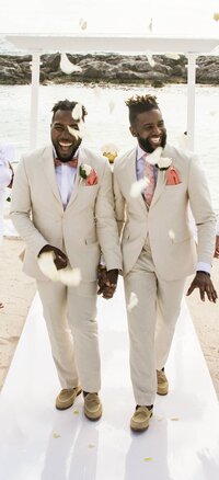bryan-preston-lgbtq-grooms-walking-aisle-destination-wedding-hard-rock-riviera-maya