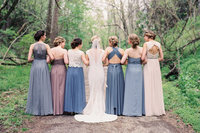 Bridesmaids with multi colored dresses
