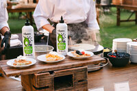 Branded food activation photographed during a corporate event, featuring product integration and guest interaction