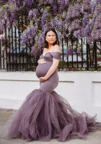 Maternity Photos in Charleston, SC -- Expectant mother poses for Maternity Portraits on Meeting Street in downtown Charleston, SC.