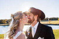 Bride and Groom sharing an intimate moment after their ceremony at Loco Lake Event Venue captured by Graceful Ray Photography in Fort Worth Texas