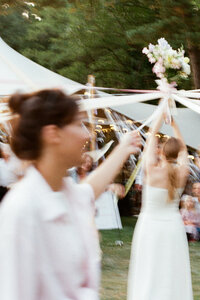 Artsy film photography of a traditional wedding bouquet ritual, focusing on cultural storytelling and authentic heritage moments.