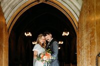 Bride and groom portrait at Duncan Memorial Chapel doorway