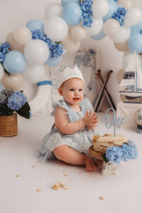Baby celebrates her 1st birthday with a Cake Smash Photoshoot at Holy City Babies Portrait Studio in Charleston, SC.