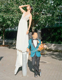wedding couple sitting on steps in manhattan