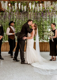 Bride and Groom's first kiss at their wedding at the Troutdale House by the Sandy River