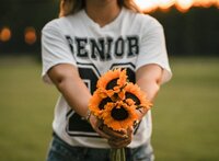 Senior Portrait at Loblolly Farm in Semmes, Alabama -- holding sunflowers
