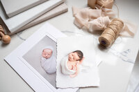 Flatlay with newborn photography and books