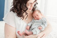 Mom and baby captured by Ann Arbor Newborn Photographer at lifestyle newborn session for preemie twin boys