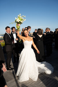 Bride and groom laughing together during cocktail hour at their Charleston, South Carolina wedding