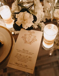 gold wedding menu card with magnolia flower